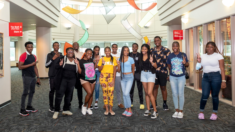 Members of the cohort of UMSL students from the Bahamas gather in the Millennium Student Center