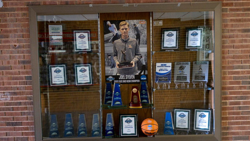 A trophy case in the lobby of the Mark Twain Athletic Center displays a picture of Joel Sylven and his national championship trophy