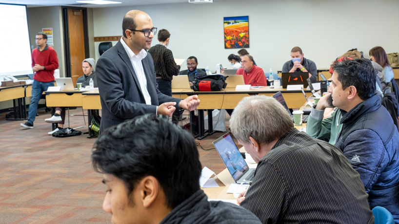 Badri Adhikari, an assistant professor in the Department of Computer Science, explains some of the principles of artificial intelligence and deep learning to the participants at a full-day, hands-on workshop on deep learning