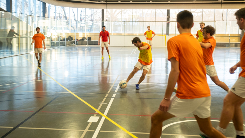 A student fires a shot toward the goal during a pickup soccer game on Feb. 3 at the Recreation and Wellness Center
