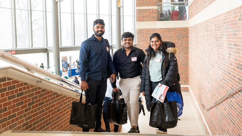 UMSL students Siddhanth Bagudum, Lalith Reddy and Jahnavi Rannam on the Touhill steps at the Spring Career Fair
