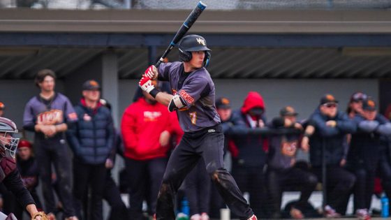 UMSL baseball player Bryce Kulinski stands at the plate ready to swing