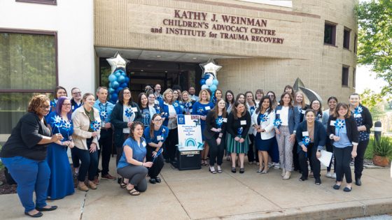Children's Advocacy Services of Greater St. Louis staff standing together outside the Kathy J. Weinman Children's Advocacy Centre