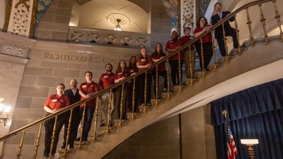 UMSL students line up on the stairs at the Missouri Capitol for a photo with UM System President Mun Choi during Undergraduate Research Day