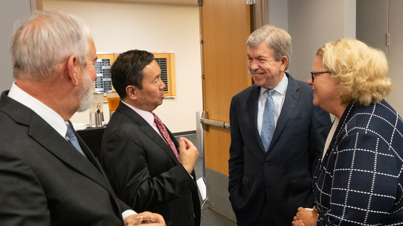 U.S. Senator Roy Blunt chats with State Historical Society of Missouri Executive Director Gary Kremer, University of Missouri President Mun Choi and University of Missouri–St. Louis Chancellor Kristin Sobolik in the MSC