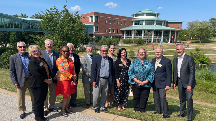 Chancellor Kristin Sobolik stands with members of the Missouri Coordinating Board for Higher Education and new Higher Education and Workforce Development Commissioner Bennett Boggs outside the Millennium Student Center