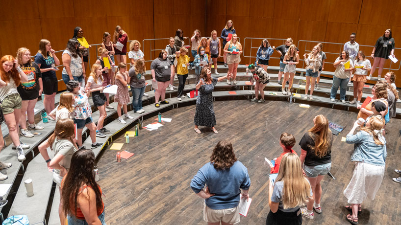 Debbie Cleveland directs students participating in “Acappellooza Summer.”