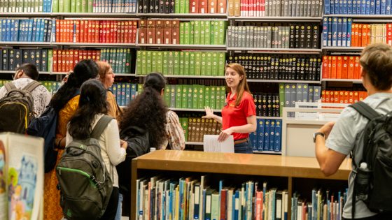 University of Missouri-St. Louis reference librarian Libby Wheeles gives a tour of Thomas Jefferson Library to new students.