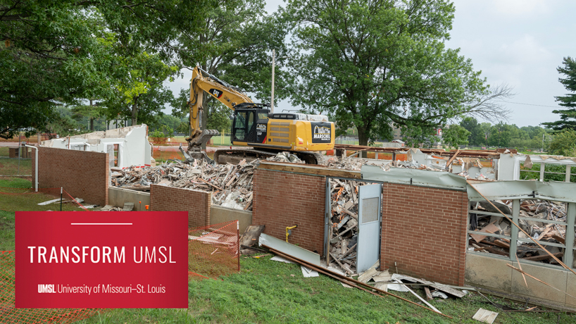 An excavator sits amid the remains of the Sassin Building on South Campus.