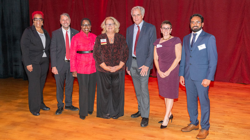 Chancellor Kristin Sobolik joins the 2023 distinguished alumni award honorees, (left to right) Petra Baker, Joseph C. Blanner, Gloria Carter-Hicks, Kevin Killeen, Mary McMurtrey and Bharath Mukka. Thursday evening was the annual University of Missouri-St. Louis Founders Celebration, held inside the Touhill Performing Arts Center.