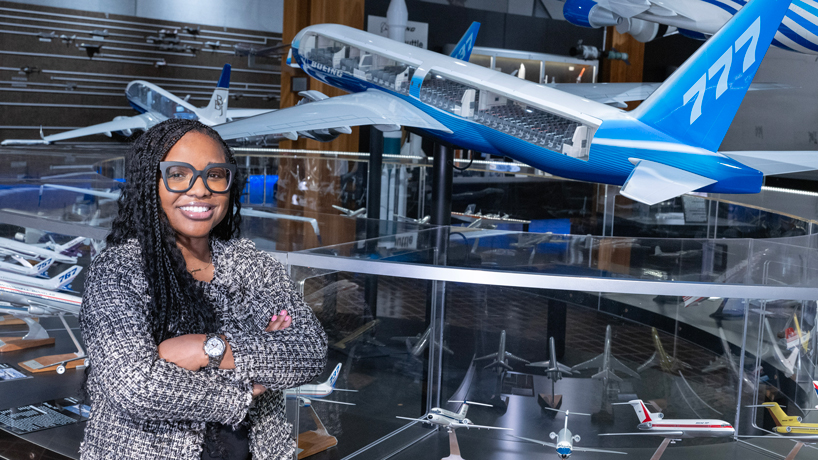 Donella Johnson stands in amid models of planes in a museum on the Boeing campus in St. Louis