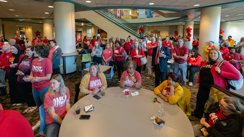 A crowd of hundreds fills the ground floor of the MSC for the Red & Gold Day celebration