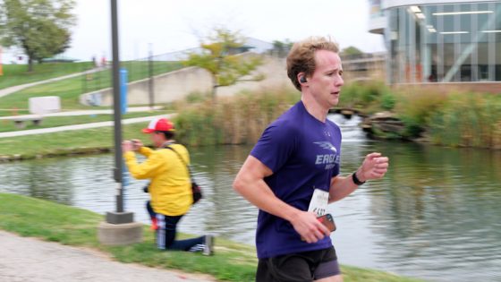 Nicolas Dunsworth runs past the MSC ponds during the UMSL Alumni Association 5K Run/Wallk