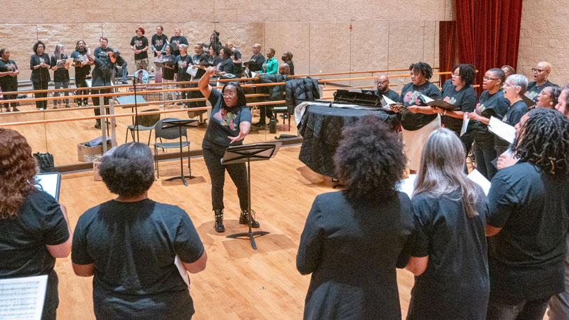 Maria A. Ellis directs the Voices of Jubilation community gospel choir during a rehearsal in the Whitaker Room