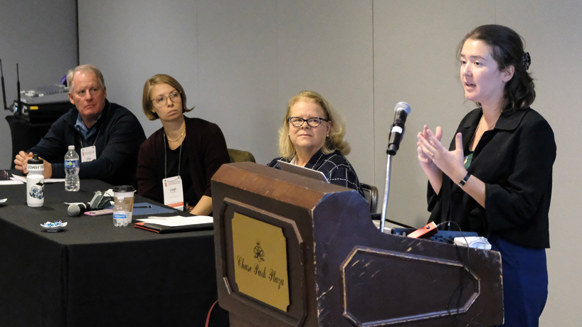 Chip Crawford, Leigh McGrath and Chancellor Kristin Sobolik listen as Liz Kramer speaks at the SCUP regional conference