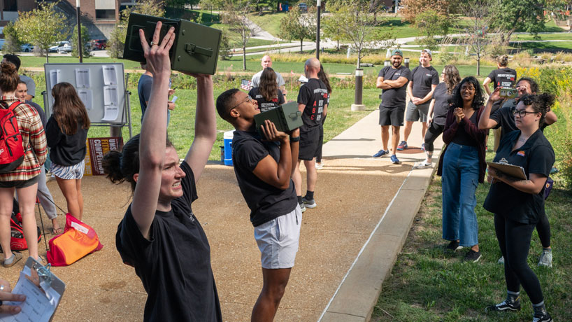 Members of UMSL's Addiction Science team participate in a combat fitness test hosted by the Veterans Center
