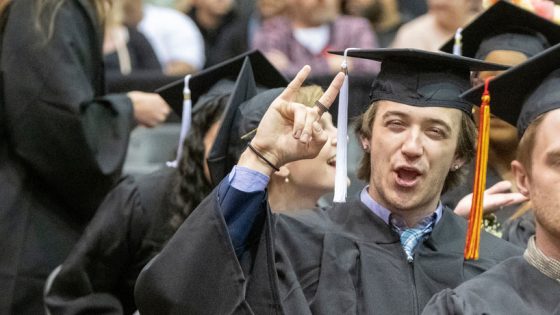 Graduate puts up rock on sign