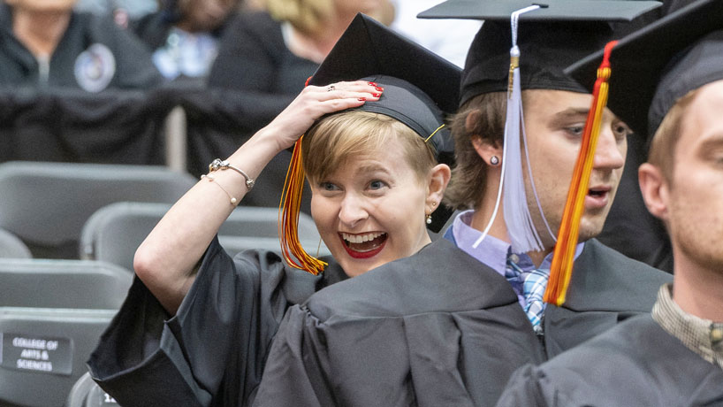 Graduate looks excited 