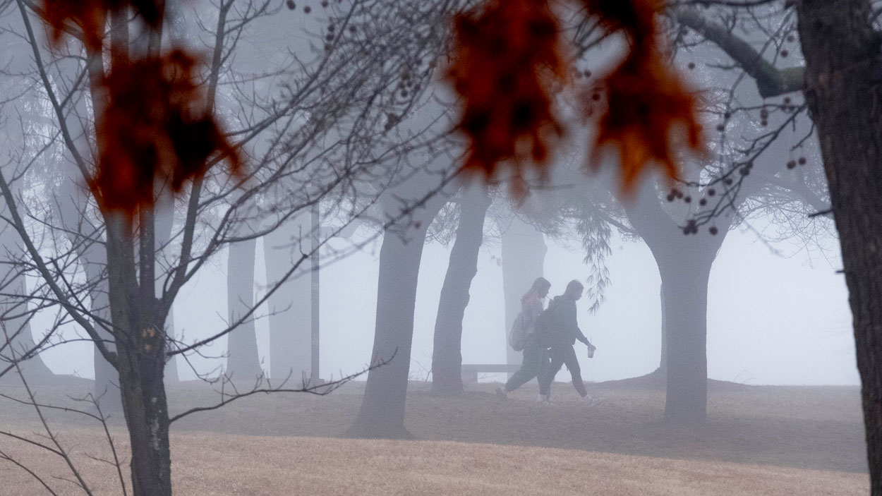 Two students walk to class through a thick morning that blanketed the University of Missouri–St. Louis last Wednesday morning, making for an eerie scene across campus.
