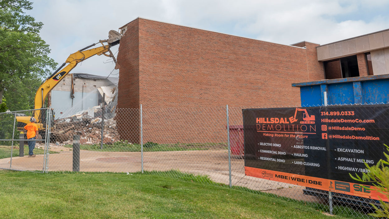 A crew from Hillsdale Demolition tears down the wall of the former J.C. Penney auditorium last summer