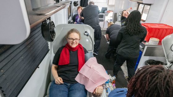 Ashleah Summers, a student support specialist in the Office of Inclusive Postsecondary Education, donates blood during the MLK Week of Service- ImpactLife blood drive on Thursday.