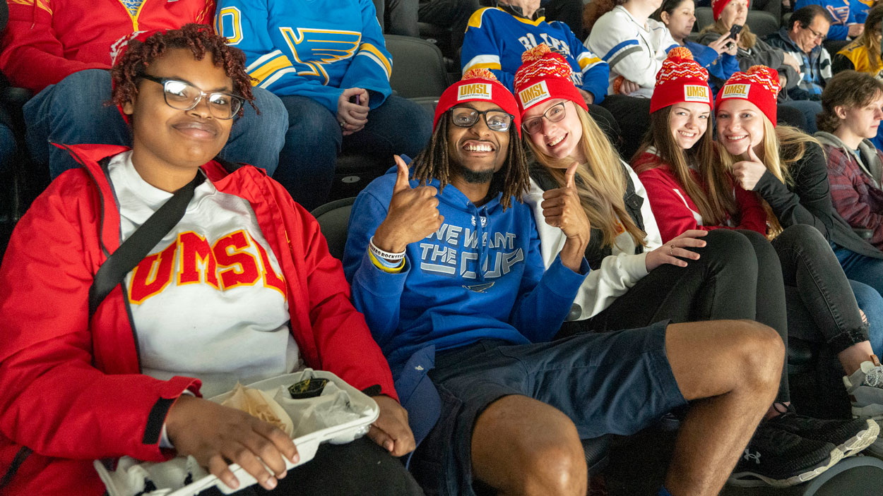 UMSL students smiling in the stands during UMSL Night at the St. Louis Blues