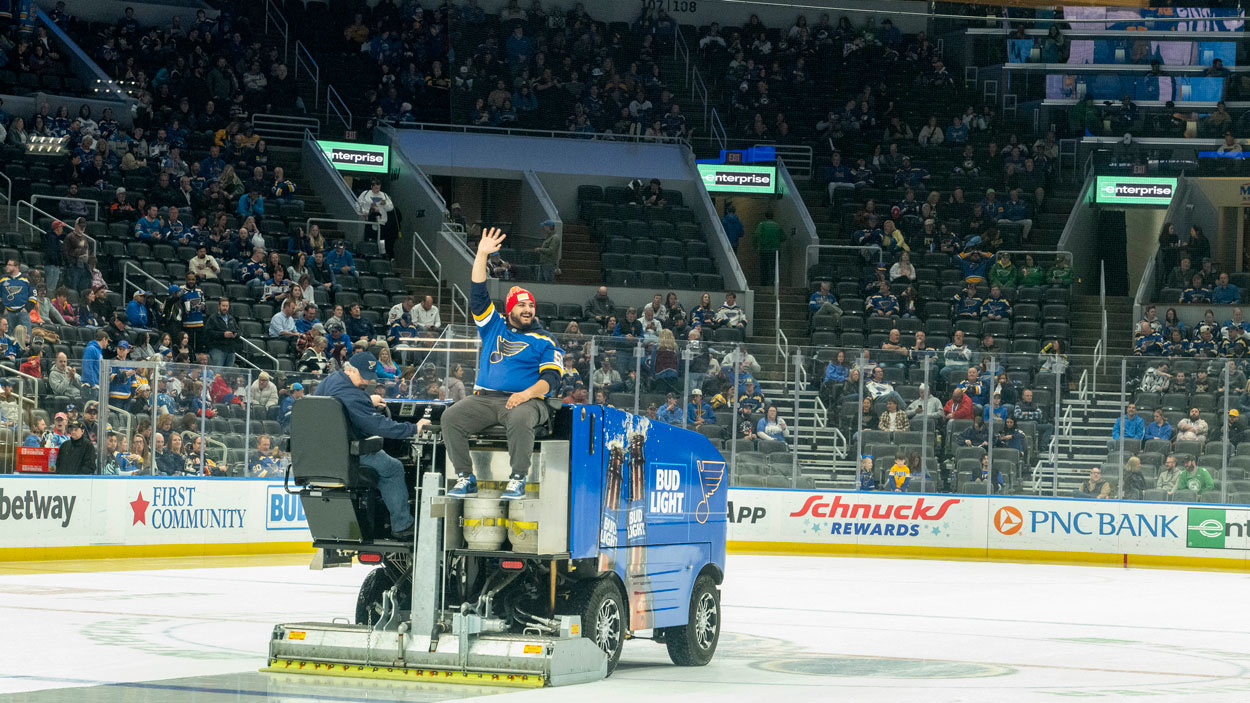 Senior communication major Fahad Albazi waves to the crowd during his Zamboni ride between the second and third periods.