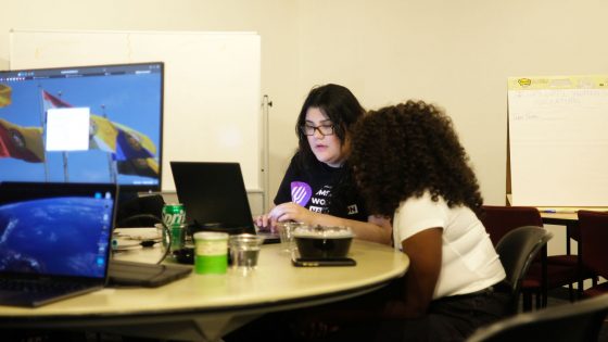 Elizabeth Treviño and a teammate work on their project.