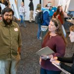 Biology PhD student Danish Gul discusses his research with faculty members Wendy Olivas and Meghann Humphries during the annual Graduate Research Fair on April 19.