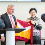 Steven J. Berberich, the provost and vice chancellor for academic affairs at the University of Missouri–St. Louis, presents an UMSL sweatshirt to Han Liming, who was visiting St. Louis over the weekend as part of a delegation from its sister city in Nanjing, China.