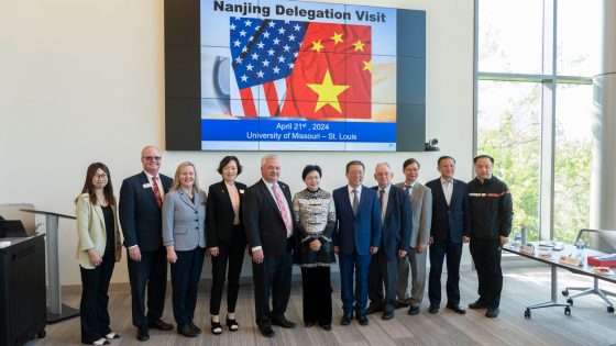 A delegation from Nanjing, China, poses for a photo to commemorate its visit with Steven J. Berberich, Shu Schiller, Liane Constantine, Joseph Rottman and Xiaoyo Pan