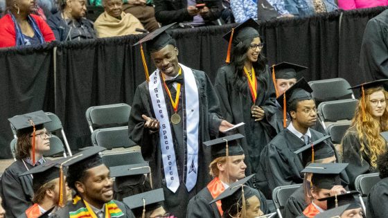 Engineering students Lorne St. Christopher II and Bushra Zaidi stand to be recognized for their accomplishments in the the Pierre Laclede Honors College.