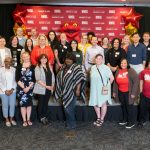 Employees marking 10 years of service at UMSL join Chancellor Kristin Sobolik, Provost Steven J. Berberich and Louie the Triton on stage during the inaugural Career Milestone Recognition Reception
