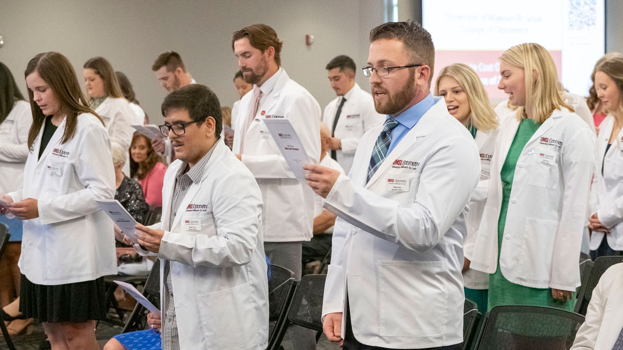 Members of the University of Missouri–St. Louis College of Optometry's 2026 graduating class recite the Optometric Oath during the 25th Annual White Coat Ceremony on May 17 in the Millennium Student Center