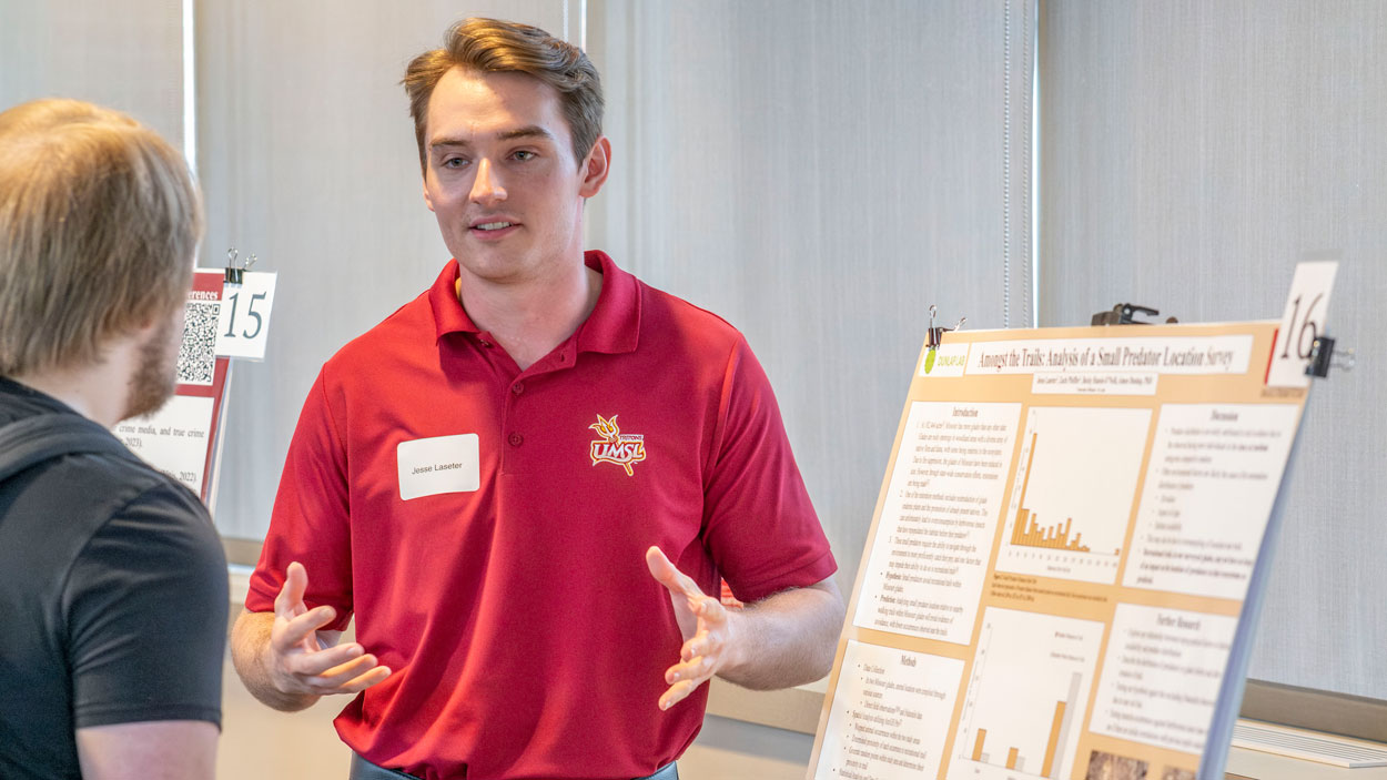 Biology graduate Jesse Laseter discusses his research on small predators in Missouri glades during the Undergraduate Research Symposium on April 26