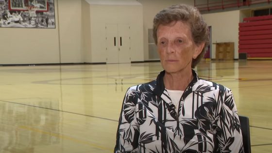 Retiring UMSL Director of Athletics Lori Flanagan sits for an interview with KSDK (Channel 5) Sports Director Frank Cusumano on the basketball court in the Mark Twain Athletic Center