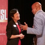 New College of Business Administration Dean Shu Schiller speaks with University of Missouri–St. Louis alum Eric Kendall Banks during a reception last Wednesday night in the E. Desmond and Mary Ann Lee Theater at the Blanche M. Touhill Performing Arts Center.