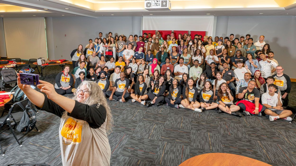 Jessica Hylton, the interim director of global students and experiences at the University of Missouri–St. Louis, took a selfie with new Tritons from around the world as UMSL welcomed 101 international students from 26 countries and five continents during Global Triton Welcome on Monday in the Millennium Student Center.