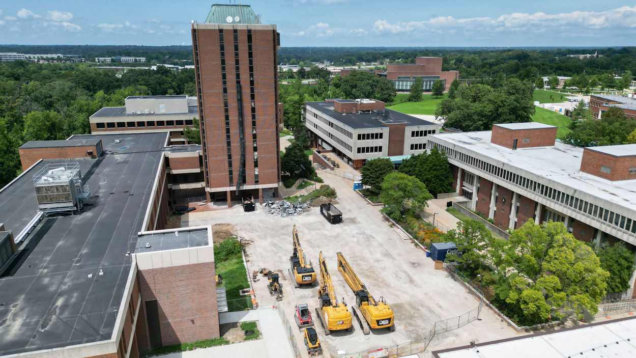 A drone captures a photos of large construction equipment parked in the cleared out Quad at the University of Missouri–St. Louis last week as the deconstruction of the Social Sciences and Business Building Tower moves forward.