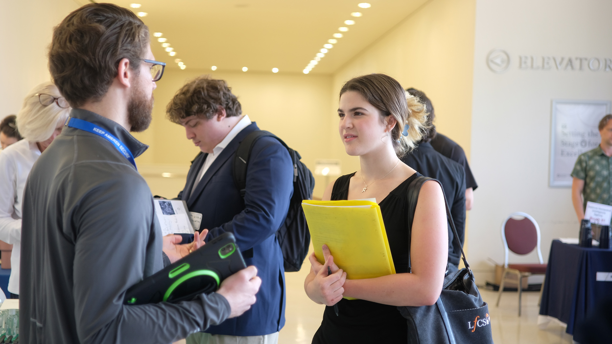 Gabrielle Bowring speaks with an Ameren representative. 