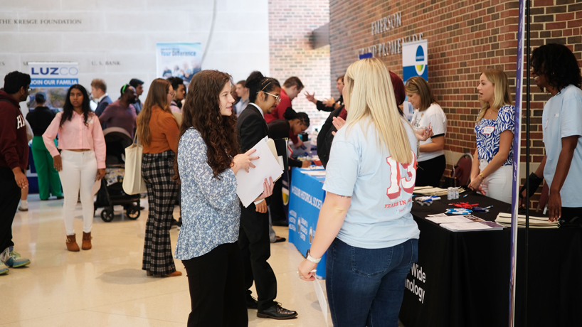 Student talks with employer 