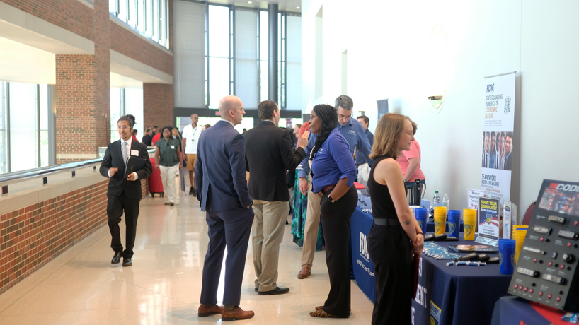 Students talk to employers at the Touhill. 