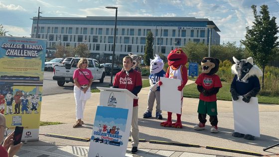 Alex Orywall speaking from a lectern at the "College Transit Challenge" kickoff