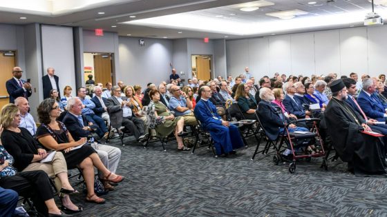 Attendees of the 30th anniversary celebration of Greek Studies at UMSL sit in the Century Rooms of the Millennium Student Center listening to one of the speakers