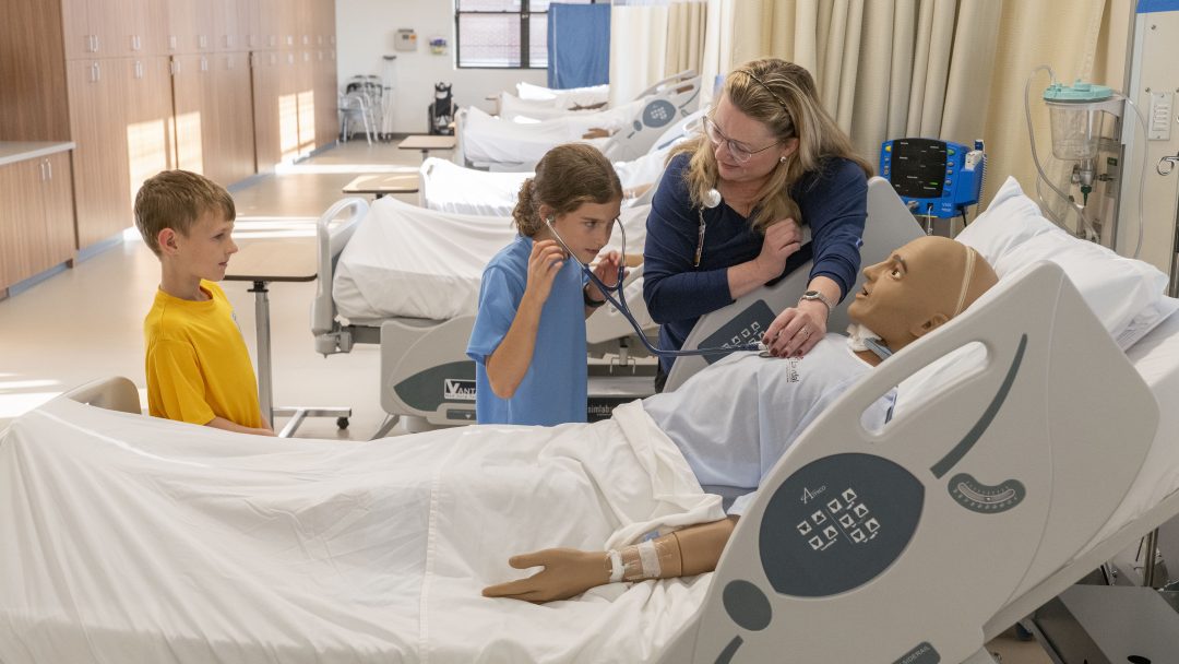 professor working in umsl nursing lab