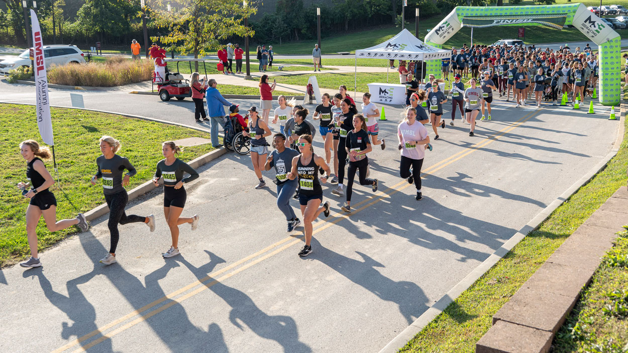 Runners set off at the start of the UMSL Alumni 5K Run/Walk on Saturday morning