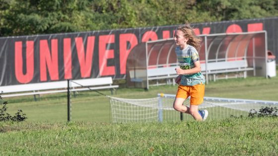 Edward Collins running near UMSL's Don Dallas Soccer Field