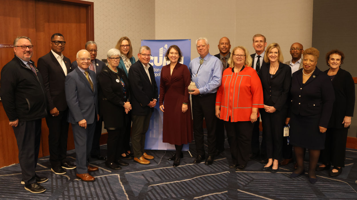 Members of the Coalition of Urban and Metropolitan Universities Board of Directors, including UMSL Chancellor Kristin Sobolik, and CUMU CEO Valerie Holton at the annual conference in Minneapolis