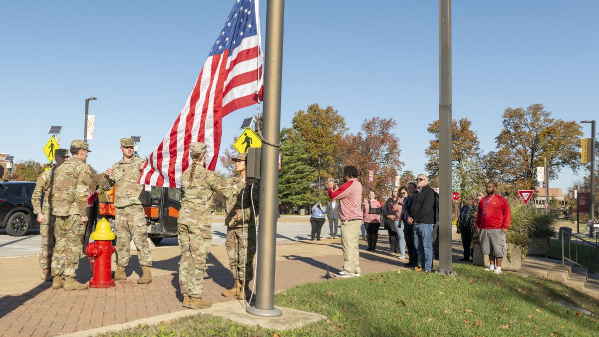 Cadets from the Gateway Battalion ROTC present the flag during a flag raising ceremony on Veterans Day