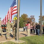 Cadets from the Gateway Battalion ROTC present the flag during a flag raising ceremony on Veterans Day